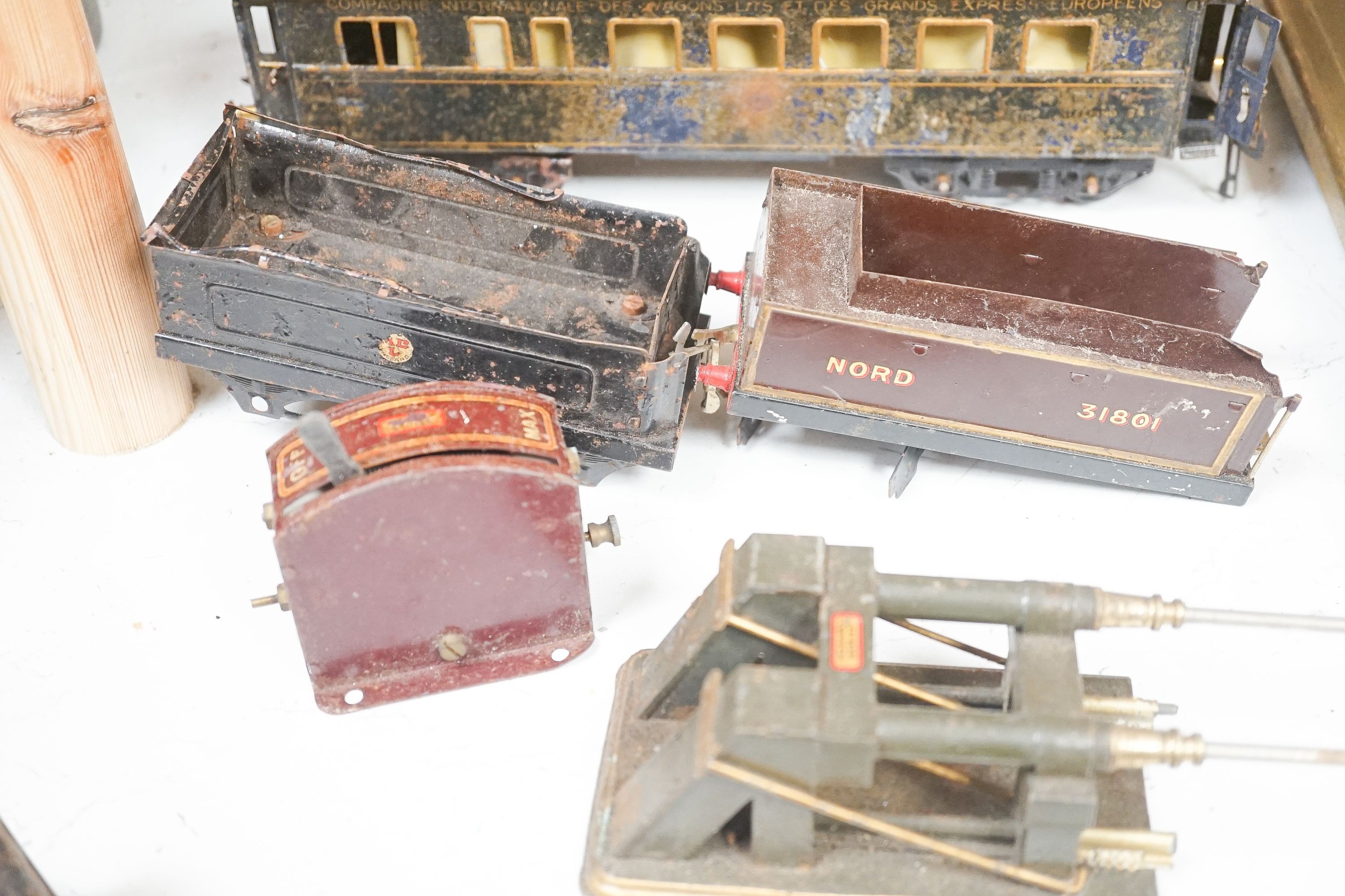 A small collection of Hornby tinplate O gauge clockwork engines and carriages etc